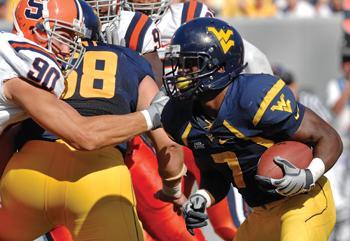 West Virginia’s Noel Devine, right, carries the ball for a 92-yard touchdown against Syracuse on Oct. 11. LSU and West Virginia have had talks about a possible future matchup.