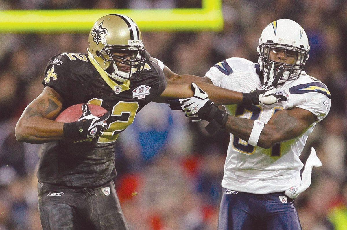 Chargers&#8217; Antonio Cromartie, right, tries to stop Saints&#8217; Marques Colston on Sunday during the game between San Diego and New Orleans at Wembley Stadium in London.