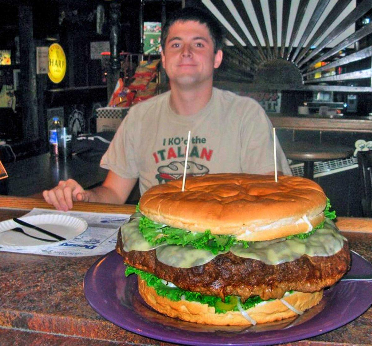 Brad Sciullo is seen before attempting to eat a 15- pound cheese burger with five pounds of toppings on Monday in Clearfield, Pa.