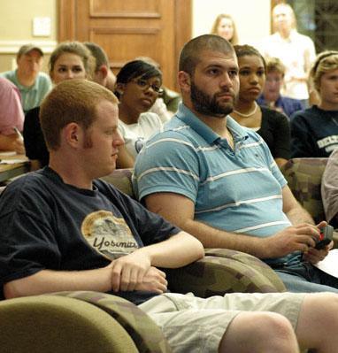 BEN HICKS / The Daily Reveille Joey Barberio (left), math sophomore, uses perception analyzers in the Journalism Building to indicate how they feel about the presidential debate Tuesday night.