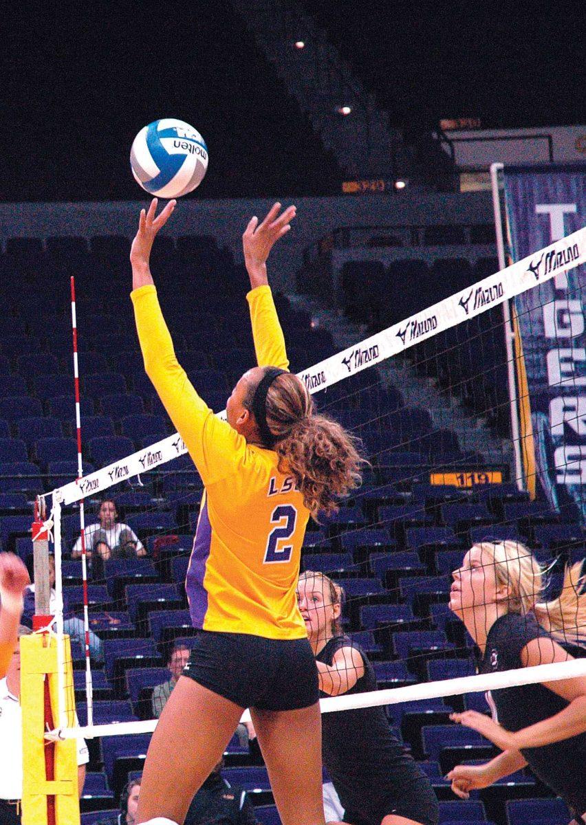 <p>Sophomore setter and outside hitter Brittney Johnson sets a ball for the Tigers during LSU’s 3-2 victory against South Carolina on Sunday.</p>