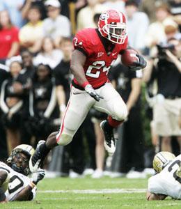 Georgia's Knowshon Moreno (24) gets past Vanderbilt's Patrick Benoist and Ryan Hamilton, right, on a run in the second quarter of an NCAA college football game in Athens, Ga., Saturday, Oct. 18, 2008.