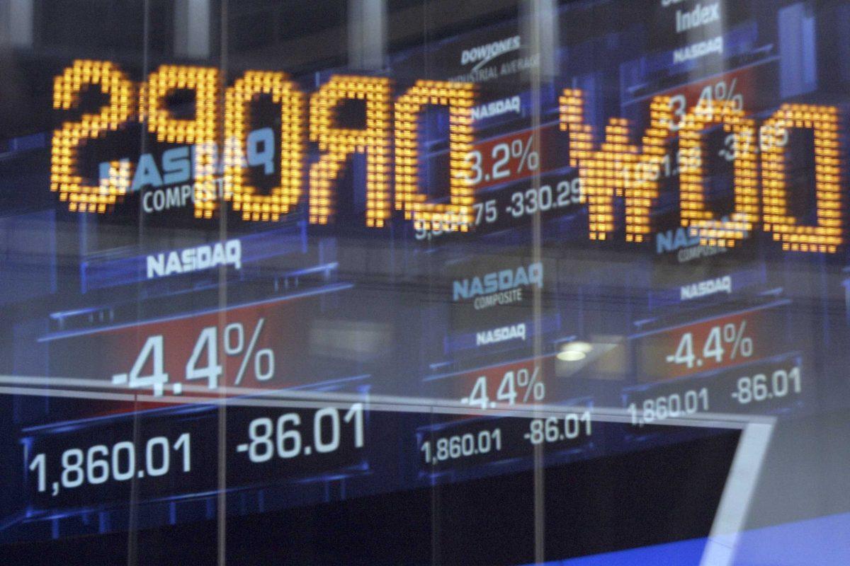 The Dow Jones news ticker is reflected on a window at the NASDAQ building just before the closing bell Oct. 6, 2008.