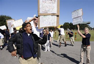 Students demonstrate outside of the Louisiana School for the Deaf, voicing their opposition to its temporary closure.