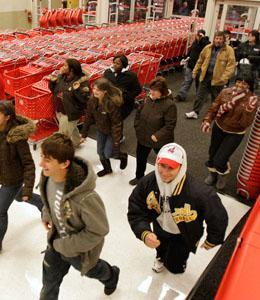 Early bird shoppers run into a Target store in Aurora, Ohio looking for bargains at the beginning of "Black Friday" shopping early Friday, Nov. 28, 2008. Shoppers, who had snapped their wallets shut since September, flocked to stores and malls before dawn Friday to grab deals on everything from TVs to toys for the traditional start of the holiday shopping season, feared to be the weakest in decades.