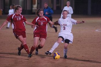 Junior midfielder Malorie&#160;Rutledge dribbles past defenders in the Tigers' 3-1 victory at home against Arkansas on Oct. 31. The Lady Tigers cliched the SEC Western Division with the win.