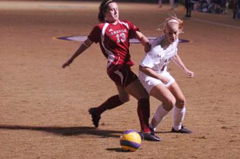 Junior defender Brittany&#160;Lowe [right] fights for the ball in the Tigers&#8217; 3-1 win Friday against Arkansas. LSU advanced in the SEC tournament Wednesday.