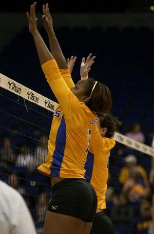 Senior outside hitter Kyna Washington (front) and freshman middle blocker Michele Williams (back) go up for a block in the Tigers' win over Mississippi State.