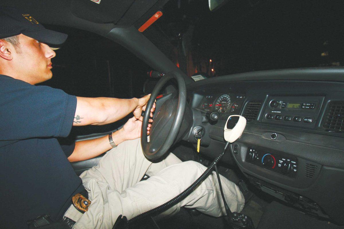 LSUPD officer Christopher Masters drives through campus while on patrol Thursday evening.