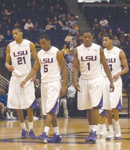 [Left to right] Senior center Chris Johnson (21), senior guard Marcus Thornton (5), junior forward Tasmin Mitchell (1) and senior guard Garrett Temple (14) walk down court Dec. 22 against McNeese State.