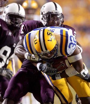 LSU junior running back Charles Scott evades a pile-up at the offensive line during the LSU-Miss. St. game Sept. 27, in Tiger Stadium