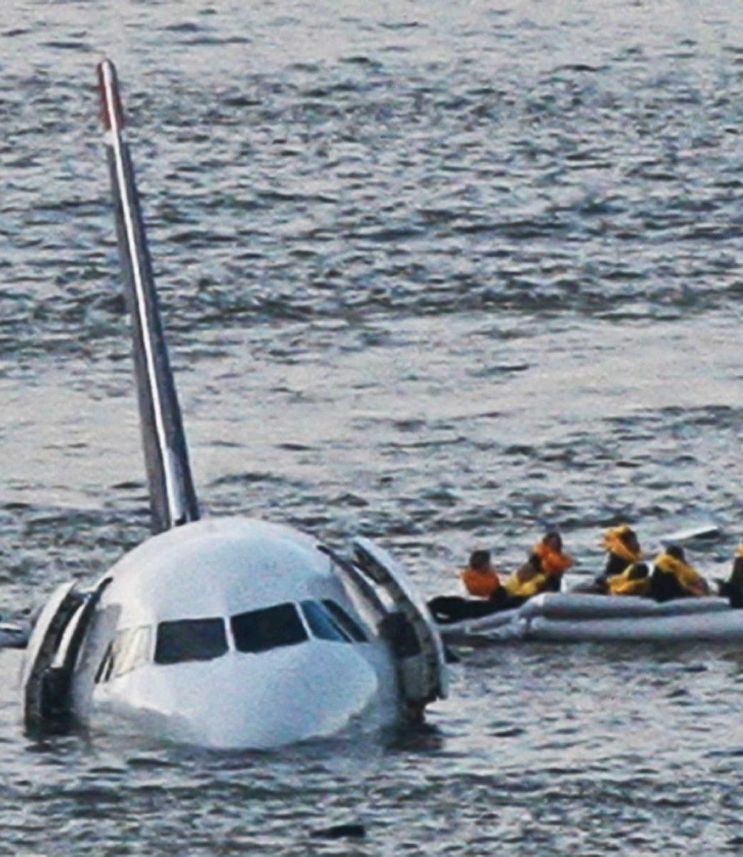 Passengers escape the plane that went down Thursday in the Hudson River.