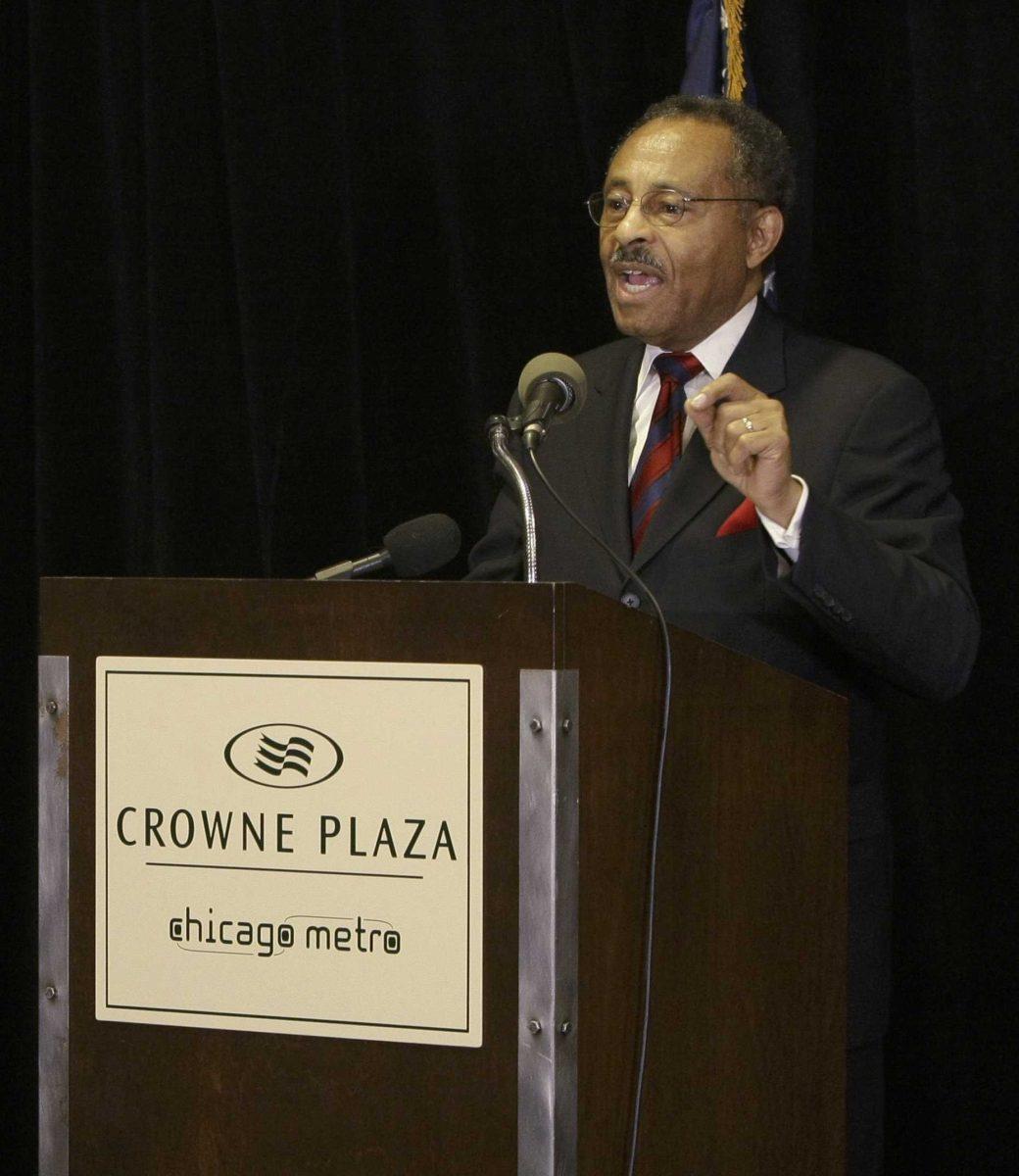 Illinois U.S. Senate appointee Roland Burris gestures, right, during a news conference in Chicago, Monday, Jan. 12, 2009. U.S. Senate leaders announced earlier Monday they'll accept Burris as U.S. President-elect Barack Obama's Senate successor and expect to swear him in soon.