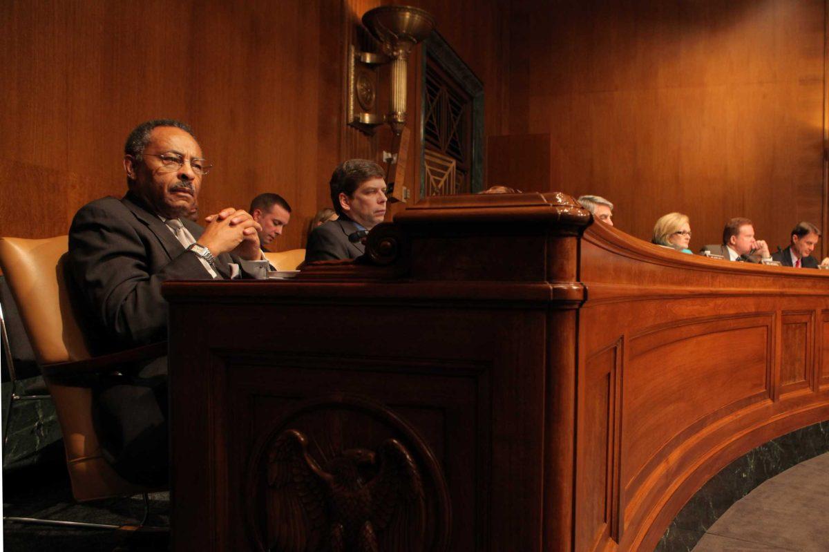 Sen. Roland Burris listens during a committee meeting Jan. 27. The Ill. GOP leaderhas asked Burris to resign from Congress.