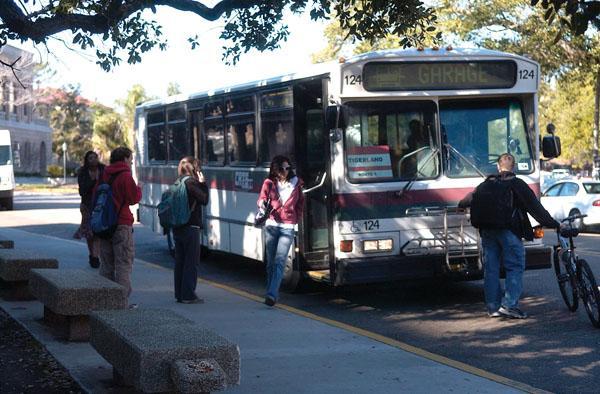 Students exit the bus Friday afternoon in front of the Journalism Building. The current buses should be replaced by newer models by fall 2010.