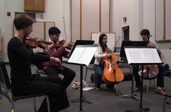 The Contemporary String Ensemble rehearses Sunday in the School of Music Building. The ensemble is working to bring their music to non-traditional settings.