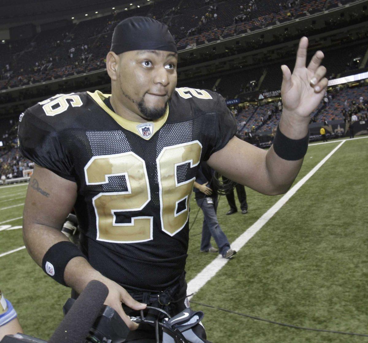 Former New Orleans Saints running back Deuce McAllister waves to fans Nov. 24 after the Saints beat the Green Bay Packers, 51-29, in the Superdome.