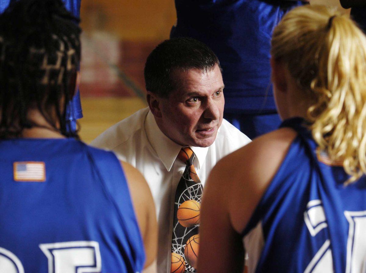 Coast Guard women&#8217;s basketball coach Alex Simonka meets with his team during a game in a 2007 file photo. Officials say the body of 52-year-old Simonka was found March 14 in his car after a self-inflicted gunshot wound to the head.