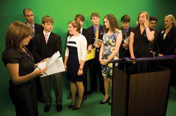 TigerTV station manager and mass communication junior Amy Vitrano hosts the TigerTV debate Monday night with the presidential candidates for today&#8217;s SG elections.