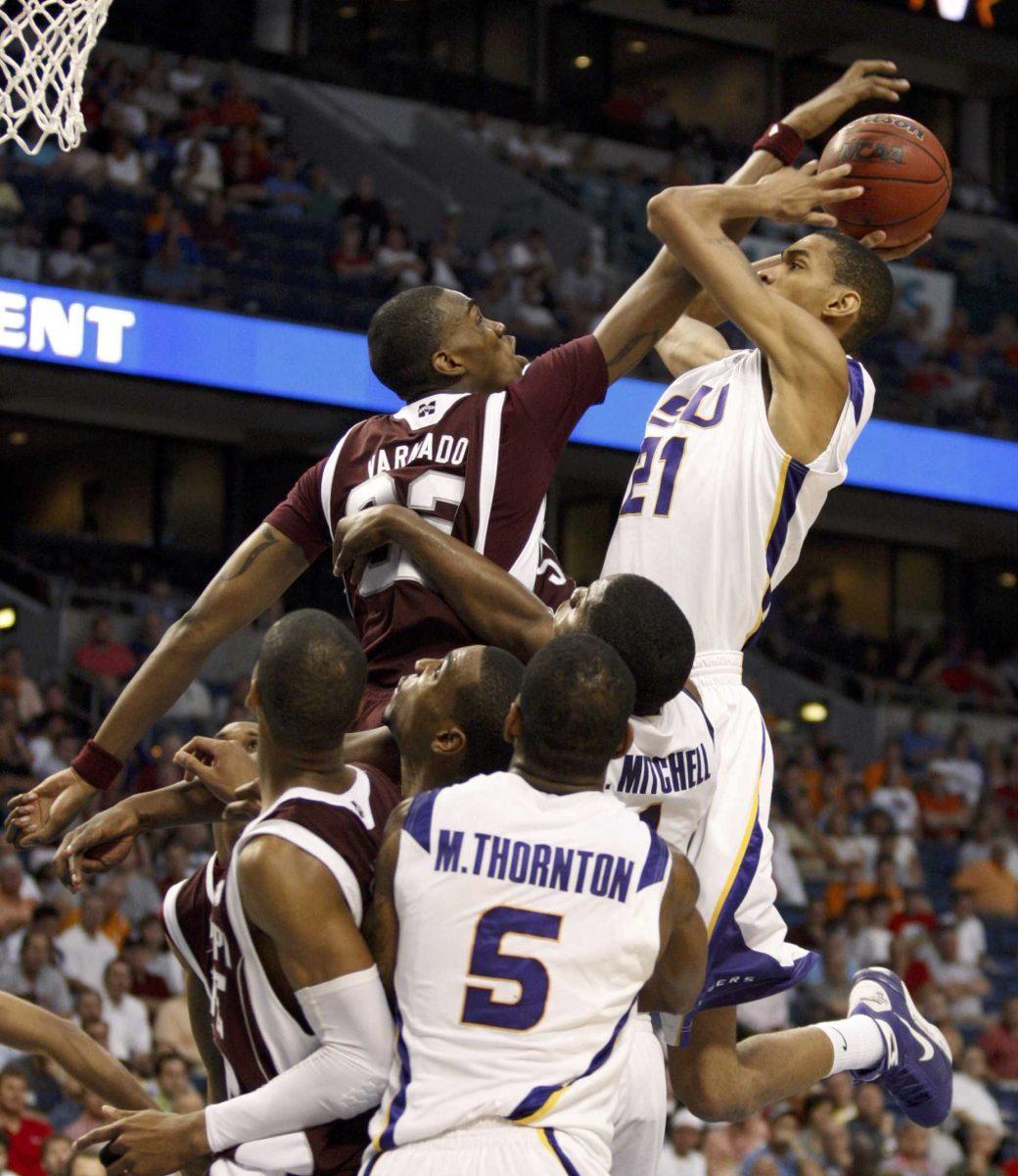 Mississippi State's Jarvis Varnado (32) blocks a shot attempt by LSU's Chris Johnson (21) during the second half of an NCAA college basketball game at the Southeastern Conference men's tournament in Tampa, Fla., Saturday, March 14, 2009. Mississippi State won 67-57.