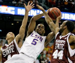 LSU's Marcus Thornton (5) shoots between Mississippi State defenders Twany Beckham (4) and Brian Johnson (44) during the first half of an NCAA college basketball game at the Southeastern Conference men's tournament Saturday, March 14, 2009, in Tampa, Fla.