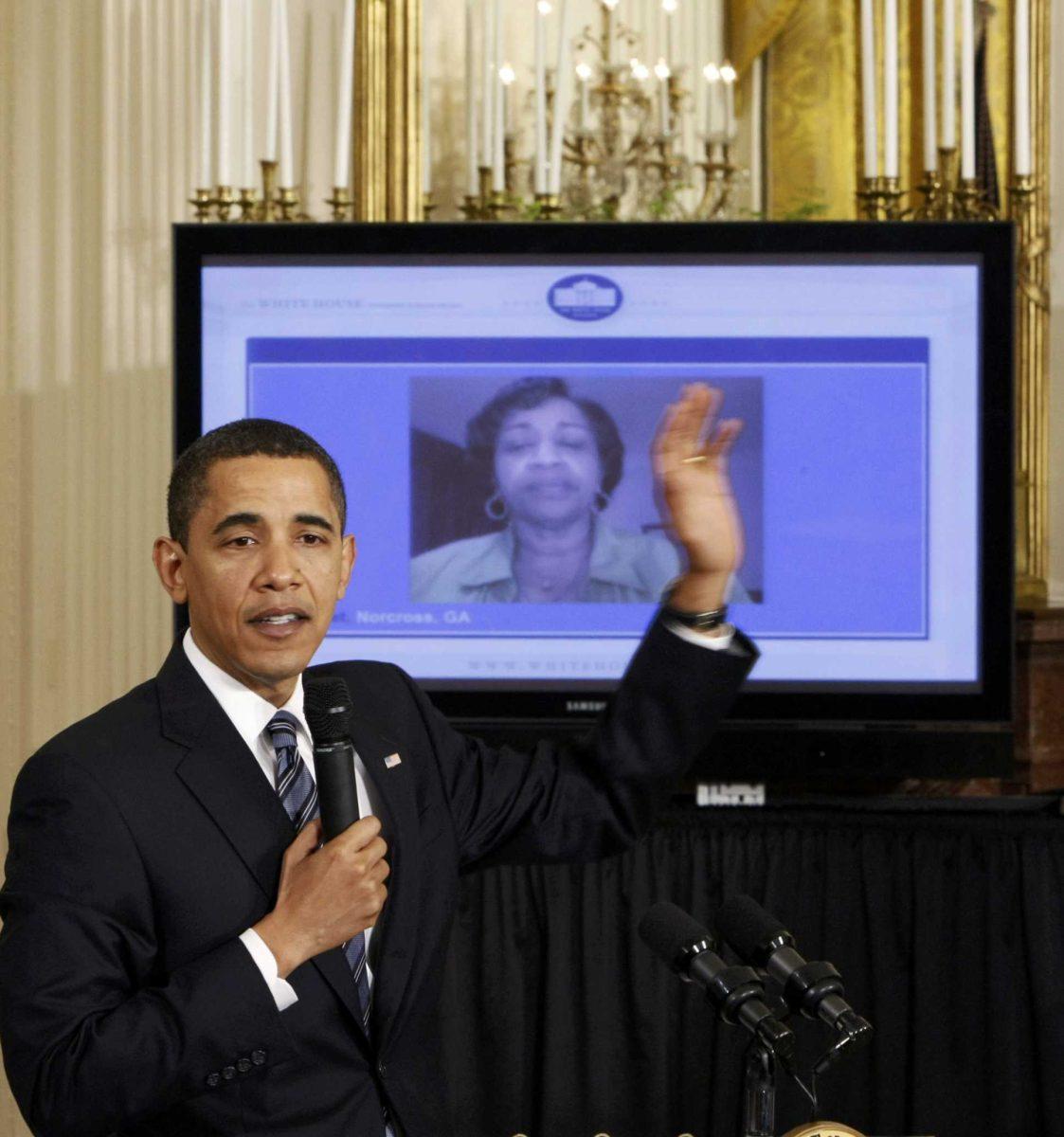 President Barack Obama addresses a question in an &#8216;Open For Questions&#8217; town-hall style meeting Thursday in the East Room of the White House in Washington. It was the first online town hall done in the White House.