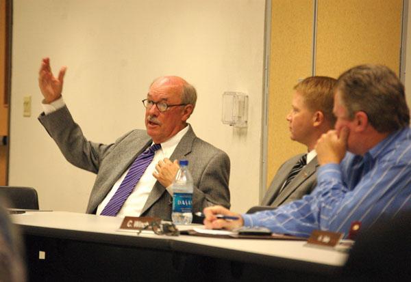 Chancellor Michael Martin speaks Wednesday morning at the Staff Senate meeting about budget cuts and plans to realign colleges.