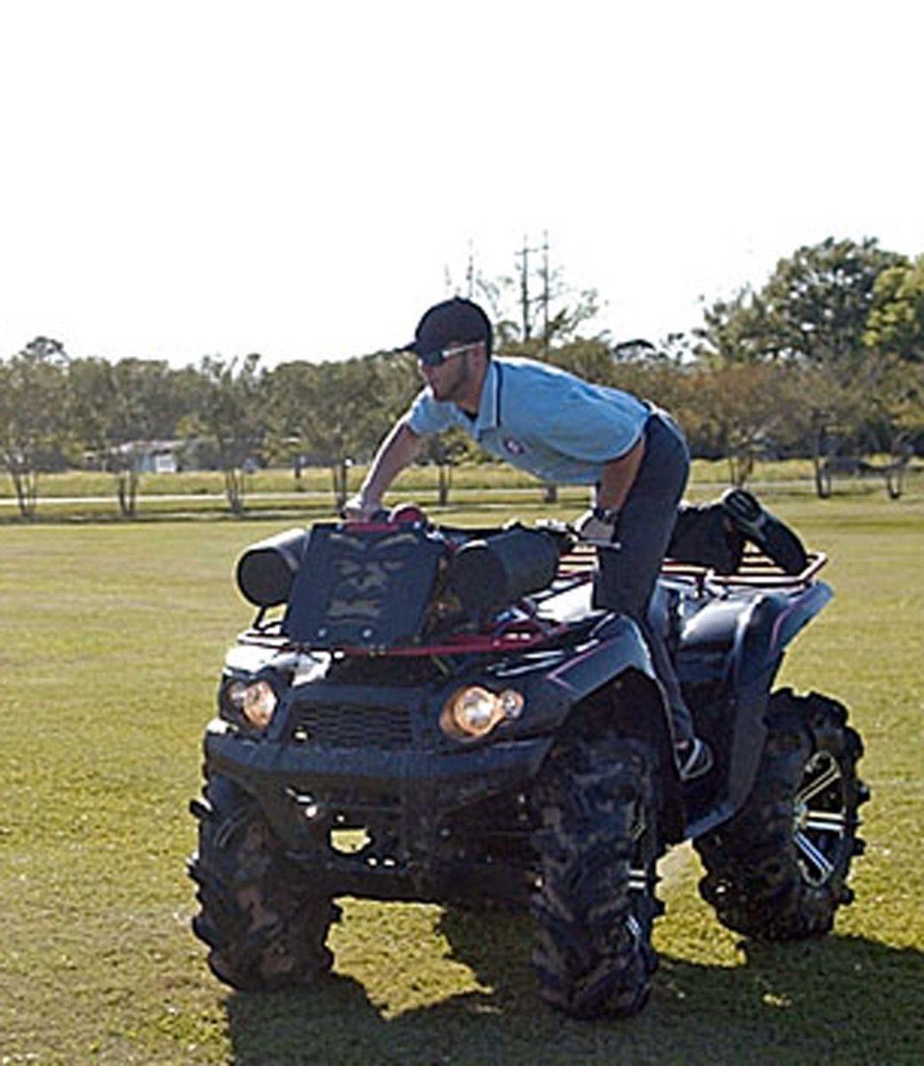 Trevor Endres, Baton Rouge Community College student, rides his ATV on Thursday in an empty fi eld in Addis. More than 150,000 ATV-related injuries happen each year.