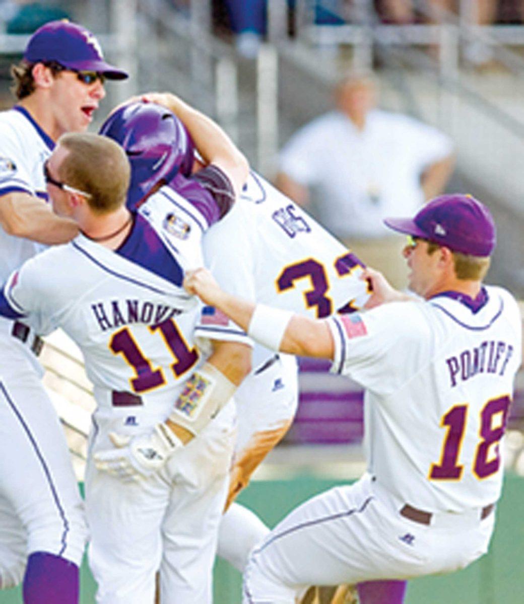 LSU senior outfielder Nicholas Pontiff (18) pulls sophomore catcher Micah Gibbs after his seventh-inning home run Saturday during the Tigers' 7-6 win against Auburn.