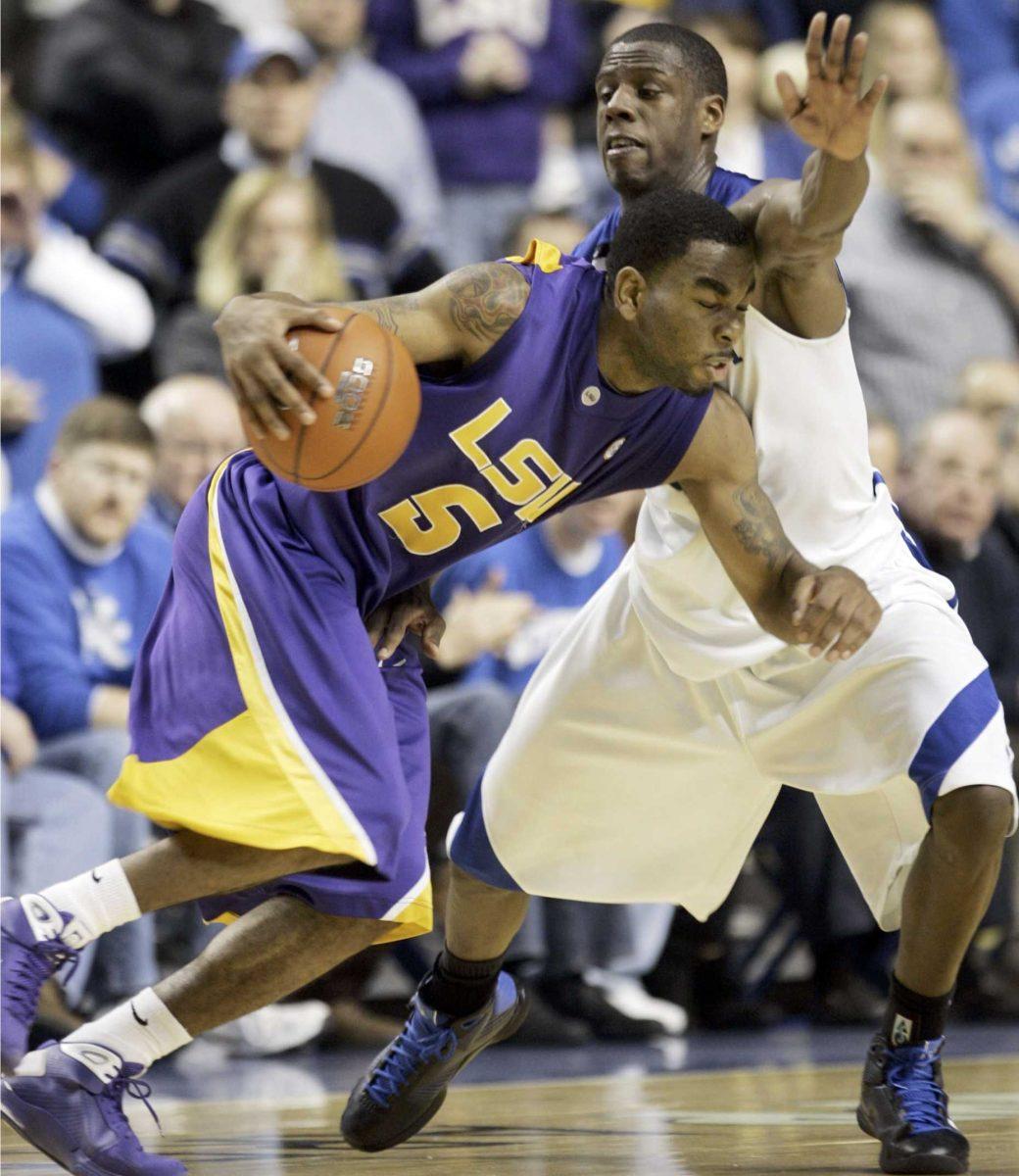 LSU's Marcus Thornton drives on Kentucky's Kevin Galloway during the second half of their game in Lexington, Ky., on Saturday, Feb. 28. Thornton had 23 points, nine rebounds and four assists in the 73-70 LSU win.