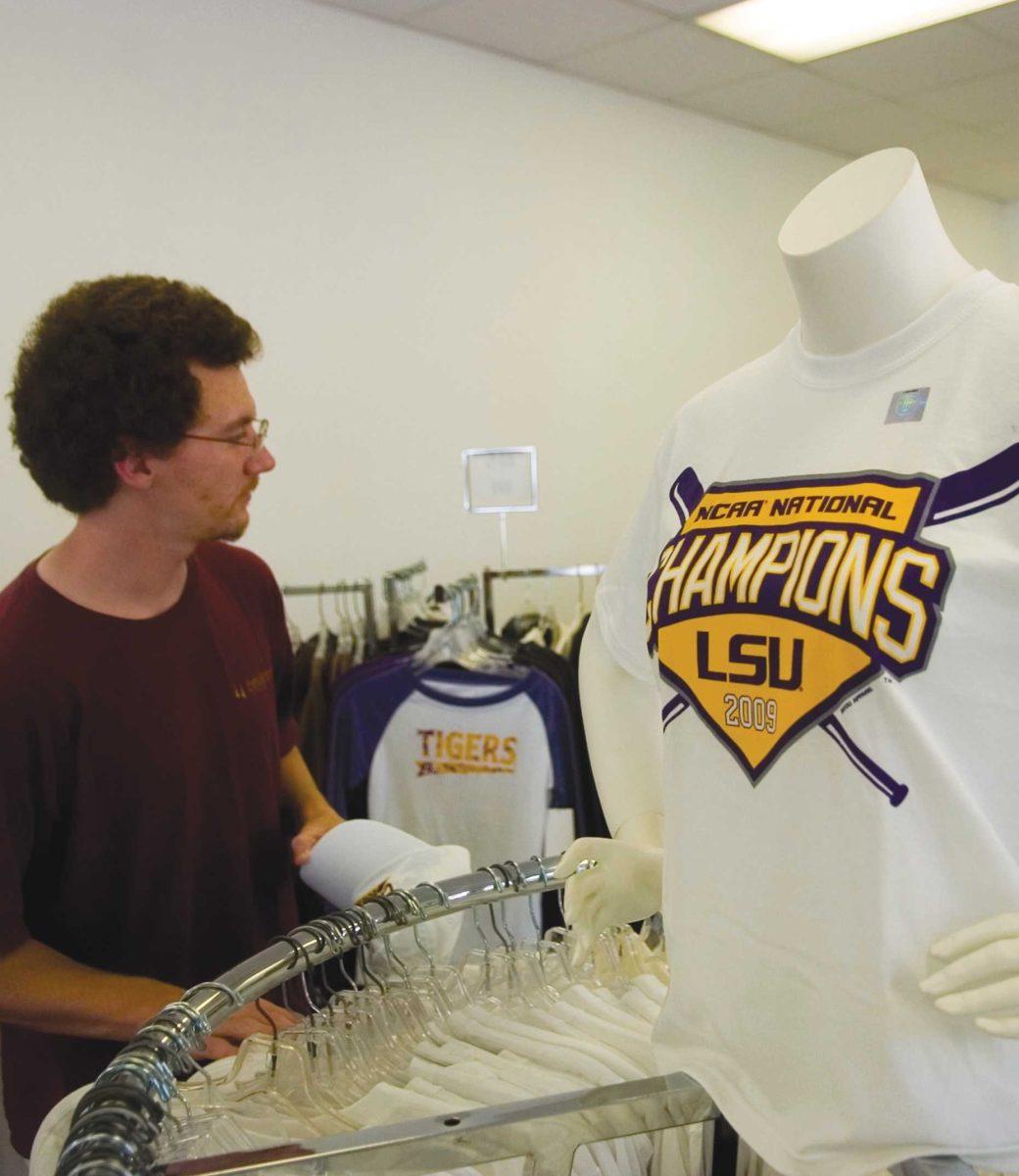 Bobby Nickens, general studies senior, shops for LSU baseball championship T-shirts Wednesday afternoon at the LSU Tiger Sport Shop.