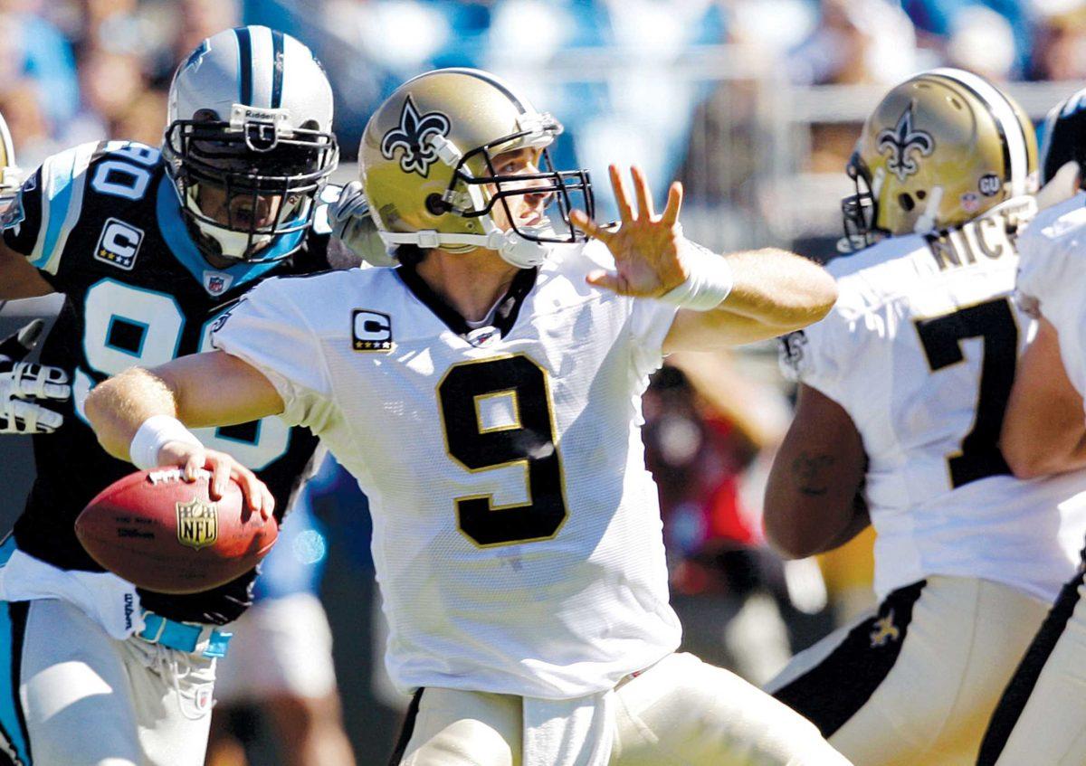 Saints&#8217; quarterback Drew Brees looks to pass Oct. 19 in Charlotte, N.C. against the Panthers.