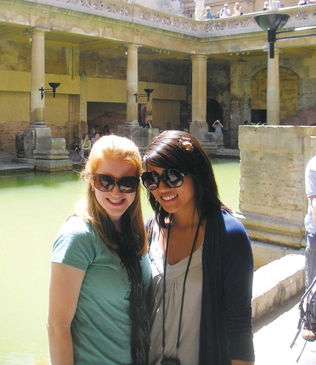 Rebecca Erwin (left) and Laura Chan (right), mass communication juniors, pose in front of the 2000-year-old Roman baths in Bath, England.