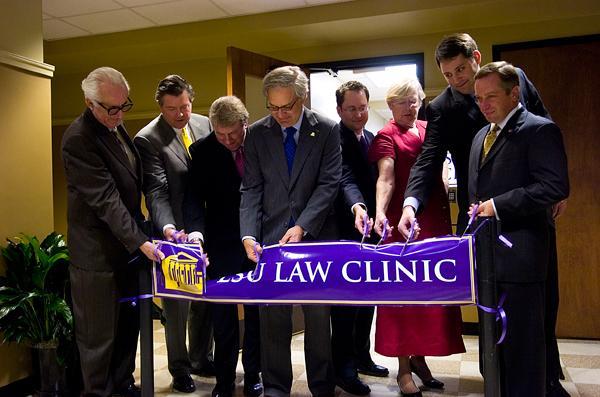 (From left to right) LSU System President John Lombardi, Frank Neuner, James Dennis, Law Center Chancellor Jack Weiss, Clinical Education Director Robert Lancaster, Lucy McGough, Scott Sternberg and Christopher Pietruszkiewicz cut the ribbon that officially opened the new LSU Law Center Clinical Legal Education Space on Friday.