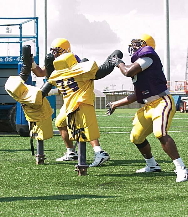 Junior linebacker Jonathan Nixon runs drills at practice Aug. 11.