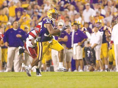 Senior running back Charles Scott (32) evades a ULL defender Saturday in LSU&#8217;s 31-3 win.