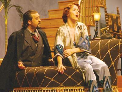 Actors Nick Rhoton, left, and Josephine Hall, right, perform as Oscar Wolfe and Julie Cavendish during a Sept. 15 showing of the play &#8220;The Royal Family&#8221; in the newly renovated Music and Dramatic Arts building.