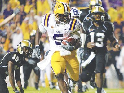 LSU running back Keiland Williams steps into the endzone to score a touchdown against Vanderbilt on Saturday. Williams scored both touchdowns in LSU&#8217;s win.