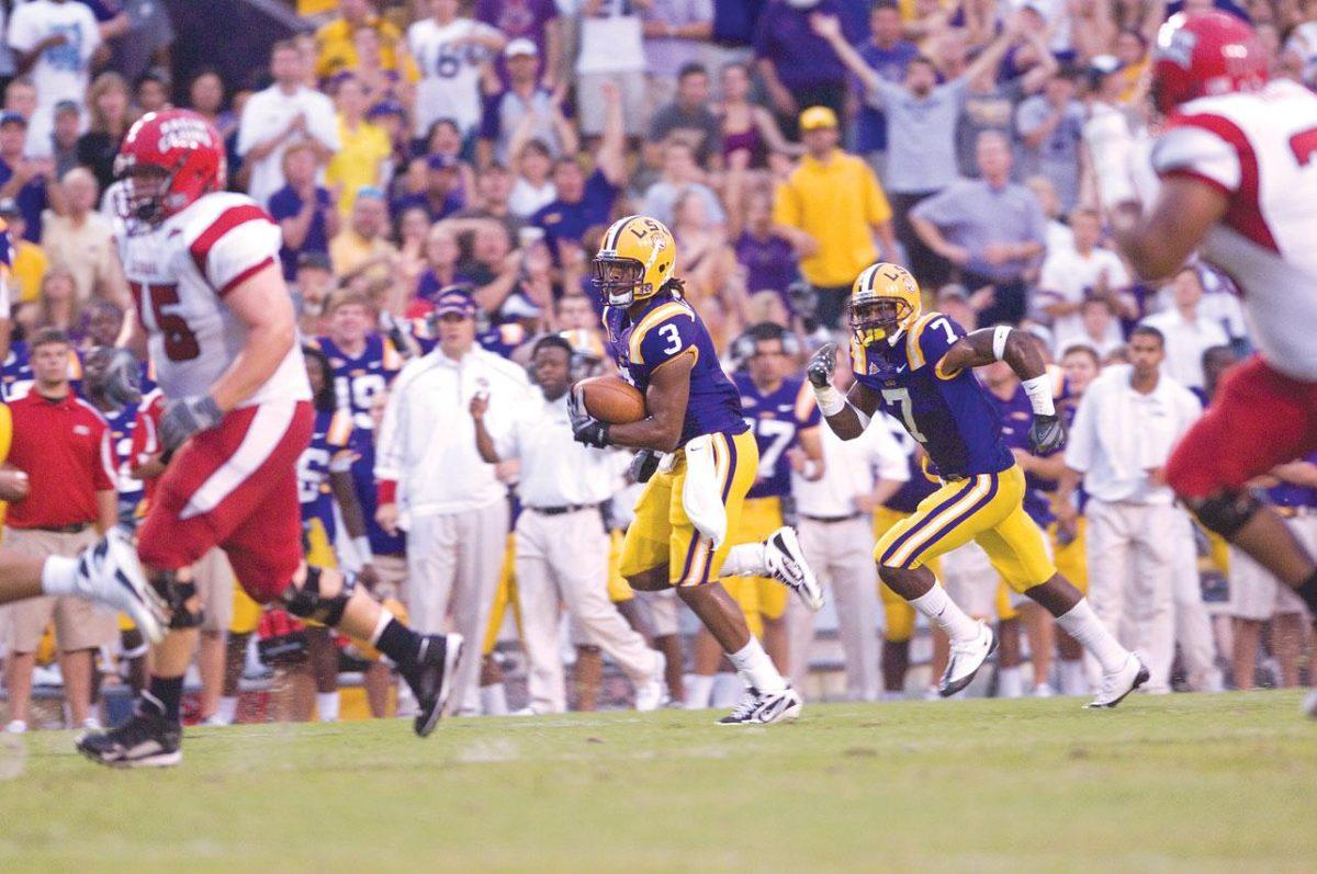 LSU junior safety Chad Jones runs the ball Saturday while sophomore cornerback Patrick Peterson follows during LSU&#8217;s 31-3 win against Louisiana-Lafayette.