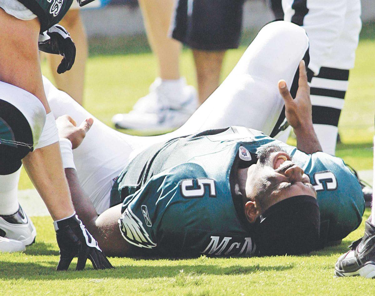 Philadelphia Eagles&#8217; Donovan McNabb (5) grimaces after being injured in the third quarter against the Carolina Panthers during a game in Charlotte on Sunday.