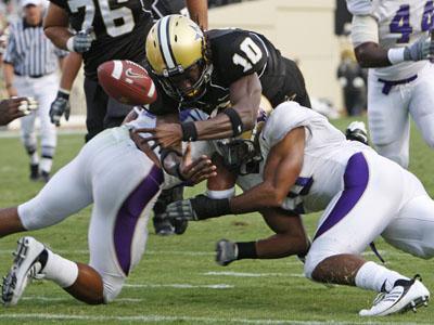 Vanderbilt redshirt sophomore quarterback Larry Smith fumbles the ball into the end zone as he is hit by Western Carolina linebacker Adrian McLeod, left, and safety Chris Collins, right, on Sept. 5. Western Carolina recovered the ball for a touchback. The Tigers face the Commodores Saturday at 6 p.m. in Tiger Stadium.