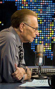 In this image released by CNN, host Larry King, left, speaks with performer Chris Brown as his mother Joyce Hawkins, center, wipes her eye during an interview Wednesday, Aug. 26, 2009, on the "Larry King Live," show in Los Angeles. The interview is scheduled to air on Wednesday, Sept. 2.