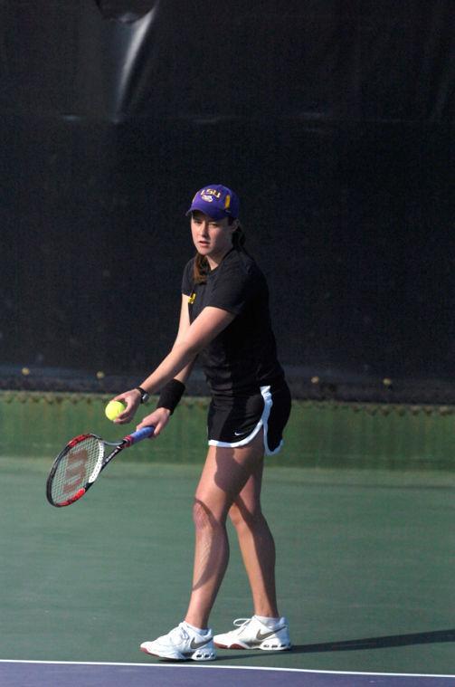 Sophomore Whitney Wolf prepares to serve Feb. 7 during a tennis doubles home match. Wolf will compete alongside three freshmen players in the Southeastern Conference Fall Classic this weekend in Nashville, Tenn.