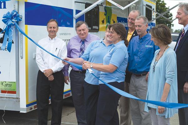 The Louisiana State Animal Response Team (LSART) and other contributors gather at the ribbon-cutting ceremony for the opening of a new animal emergency response unit at the LSU Vet School&#8217;s Equine Lameness Pavillion.