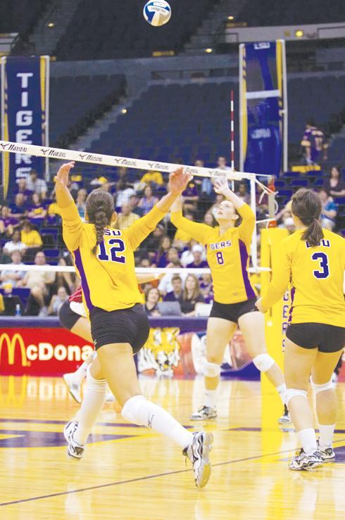 Senior outside hitter Marina Skender (12) gets ready to jump to hit a set from senior setter Sam Dabbs (8) in the Tigers&#8217; 3-2 loss to Nebraska on Sept. 4.