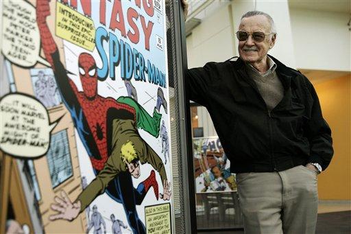 FILE - In this March 21, 2006 file photo, comic book creator Stan Lee stands beside some of his drawings in the Marvel Super Heroes Science Exhibition at the California Science Center in Los Angeles. The Walt Disney Co. on Monday, Aug. 31, 2009 said it is buying Marvel Entertainment Inc. for $4 billion in cash and stock, bringing such characters as Iron Man and Spider-Man into the family of Mickey Mouse and WALL-E.