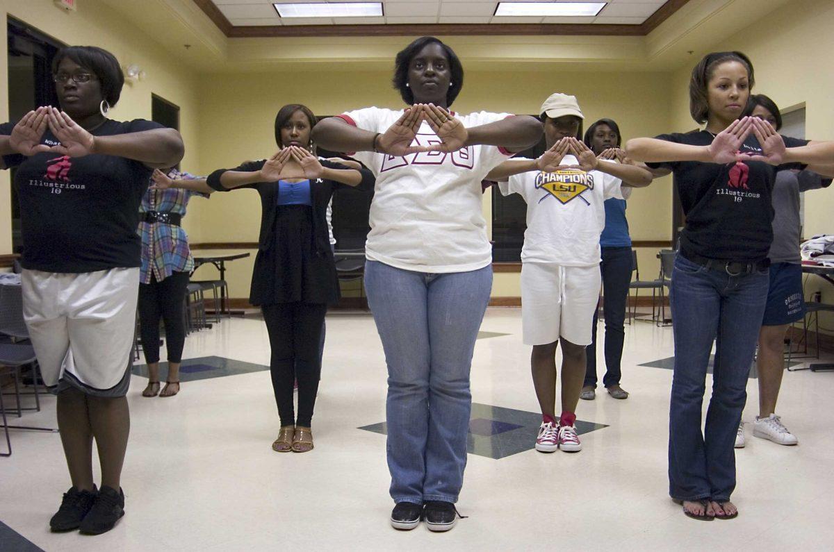 Members of the Delta Sigma Theta sorority practice their steps Tuesday night.