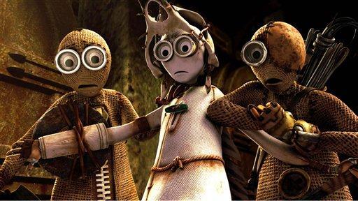 In this film publicity image released by Focus features, the characters, from left, #9, voiced by Elijah Wood, #7, voiced by Jennifer Connelly, and #5, voiced by John C. Reilly shown in a scene from the animated film, "9."