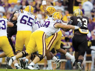 Sophomore left guard Josh Dworaczyk tackles Vanderbilt redshirt sophomore linebacker Chris Marve in LSU&#8217;s 23-9 win Sept. 12 in Tiger Stadium.