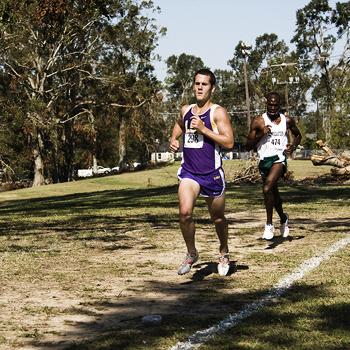 Senior Andy Florek runs ahead of a Southeastern Louisiana runner in the LSU Tiger Cross Country Festival in 2008. Florek will redshirt this season for academic reasons.